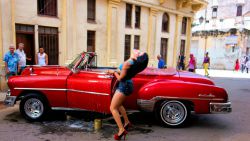 Washing An Old Chevy In Havana 